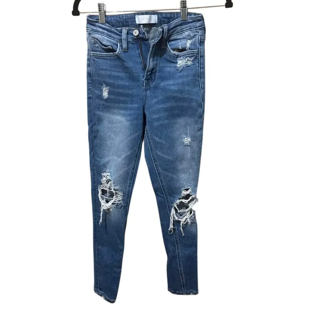 Blue distressed skinny jeans with